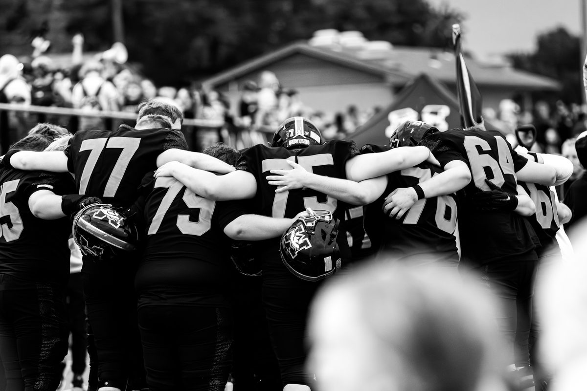 Offensive line at the snap during a Mustang football game